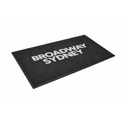 PrintPlush Logo Mat featuring a custom logo design, shown from the side, perfect for adding branding to entryways.